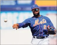  ?? Julio Cortez / Associated Press ?? Mets second baseman Robinson Cano warms up before spring training game against the Cardinals on March 11. Cano was suspended for the 2021 season after testing positive for PEDs.