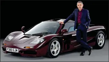  ??  ?? Flash: Rowan Atkinson poses with a McLaren F1. He bought one of just 64 made