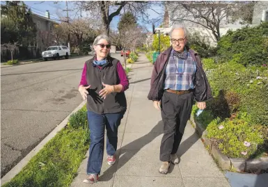  ?? Photos by Brittany Hosea-Small / Special to The Chronicle ?? Kaiser Permanente members Janine Bajus and John Culver go for their daily walk near their Berkeley home.