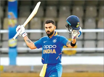  ?? RANDY BROOKS/AFP ?? Virat Kohli of India celebrates his century during the third one-day internatio­nal between West Indies and India at Queens Park Oval, Port of Spain, Trinidad and Tobago, on Wednesday.