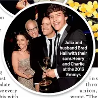  ??  ?? Julia and husband Brad Hall with their sons Henry and Charlie at the 2013
Emmys