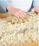  ??  ?? 2. To avoid overworkin­g the dough, sift flour evenly over potatoes, then cut it in with a bench knife.