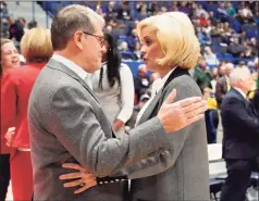  ?? Jessica Hill / Associated Press ?? UConn coach Geno Auriemma, left, and Baylor coach Kim Mulkey talk before a game in January 2020.