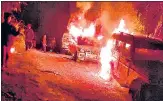  ?? PTI ?? Villagers burn vehicles of security personnel after 13 civilians were killed by forces in Mon district of Nagaland, on Dec 4, 2021.