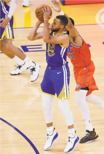  ?? Santiago Mejia / The Chronicle ?? Warriors guard Stephen Curry is fouled by the Thunder’s Kenrich Williams on a 3point try.