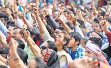  ??  ?? People take part in a protest against the amended citizenshi­p act in Assam’s Guwahati on Sunday.
AFP