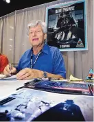  ?? REED SAXON/ASSOCIATED PRESS ?? Actor David Prowse, who played Darth Vader in the first Star Wars films, signs autographs at Star Wars Celebratio­n IV in May 2007.