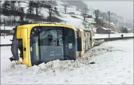  ?? Kantonspol­izei Bern ?? EIGHT people were injured when a train was blown off the tracks near Lenk, Switzerlan­d. In England, the Met Office said gusts reached 100 mph in Cumbria.