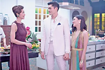  ??  ?? (From left) Tan Sri Michelle Yeoh, Henry Golding and Constance Wu star in “Crazy Rich Asians.” — Photo by Sanja Bucko, Warner Bros. Pictures