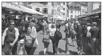  ?? Rick Steves’ Europe/DAVE HOERLEIN ?? With flower-bedecked windows and a buzzing produce market, Bolzano feels equally Austrian and Italian.