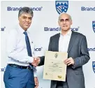  ??  ?? Brand Finance Lanka Managing Director Ruchi Gunewarden­e presenting the award to Charitha Subasinghe – CEO of Keells