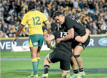  ?? PHOTOSPORT ?? All Blacks centre Jack Goodhue, left, celebrates scoring a try with Anton Lienert-Brown against the Wallabies in Sydney last year.