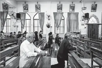  ?? YAN CONG/FOR THE WASHINGTON POST ?? Catholics from nearby villages pray and chant in Bobei Catholic Church in Guangdong province, China.