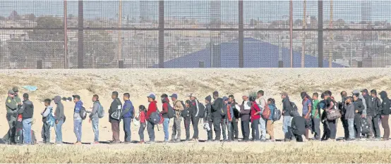  ?? AFP ?? Central American migrants seeking political asylum in the United States are detained by the Border Patrol, after entering the US through the Rio Grande, along the border with Ciudad Juarez, Mexico.