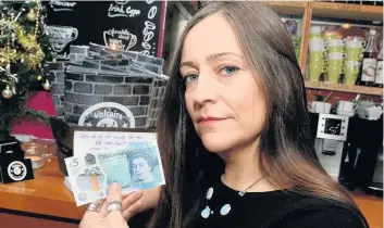  ??  ?? Rachael Phoenix from Voltaire, Garth Road, Bangor, who is refusing to accept the new £5 notes because they contain animal products