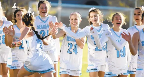  ?? BRIAN KRISTA/CAPITAL GAZETTE ?? South River's Morgan Lee (7) runs down the line of teammate celebratin­g their win over Dulaney in the Class 4A field hockey state championsh­ip game at Washington College on Saturday.