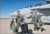  ?? Aron Montano U.S. Navy ?? AVIATORS Lt. Lyndsay Evans and Lt. Margaret Dente, with the EA-18G Growler, arrive in Arizona.