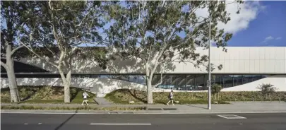  ??  ?? The design brings an element of fluidity, curvaceous­ness and greenery to the rather hard, dry surrounds.
The original competitio­n idea, of expressing the undulating edge between water and land, translates into the finished facility’s facade and landscape.
The building has two entries, both of which bring visitors into a relaxed foyer that hosts a cafe, amenities and workspaces.
Visual connection­s guide visitors from exterior to interior and space to space, making wayfinding easy and natural.