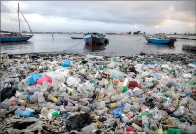  ?? (Ap/odelyn Joseph) ?? Litter and debris blanket the shoreline March 10 in Cap-haitien, Haiti. In several reports released in October, the U.S. signaled that climate change would occupy a central role in security strategy, a shift in strategy that underscore­s how climatic changes are exacerbati­ng long-standing problems. One of the studies identified Haiti as one of 11 countries that were of “greatest concern.”