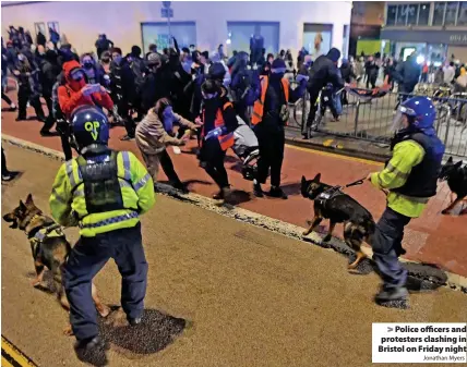  ?? Jonathan Myers ?? Police officers and protesters clashing in Bristol on Friday night