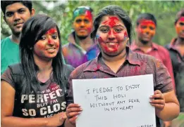  ??  ?? People in India taking a #SafeCityPl­edge for Holi.