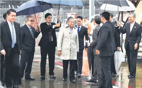  ??  ?? Dr Mahathir being welcomed upon arrival at Haneda Internatio­nal Airport. — Bernama photo