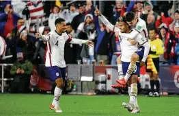  ?? Kirk Irwin / Getty Images ?? U.S. midfielder Weston McKennie (8) is congratula­ted by Christian Pulisic, on back, and Tyler Adams (4) after scoring a goal in the team’s 2-0 win over Mexico.