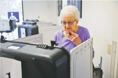  ?? STAFF PHOTO BY DOUG STRICKLAND ?? Frankie Trotter votes on election day at City Hall on Tuesday in Fort Oglethorpe, Ga.