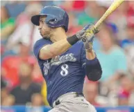  ?? | AP ?? The Brewers’ Ryan Braun singles in the first inning. Braun also homered and drove in four runs in a 9- 8 victory.