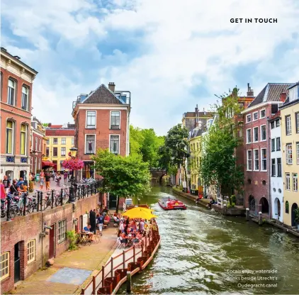  ?? ?? Locals enjoy waterside drinks beside Utrecht’s
Oudegracht canal