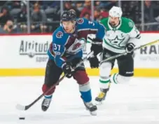  ?? David Zalubowski, The Associated Press ?? Avalanche left wing J.T. Compher, being chased by Dallas Stars left wing Jamie Benn, continues to fill in on the top line in the absence of Gabe Landeskog.