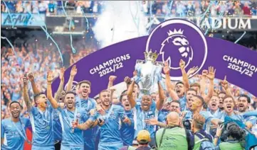  ?? AP ?? Manchester City players celebrate with the trophy after winning the Premier League at Etihad Stadium in Manchester on Sunday.