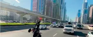  ??  ?? Captain Abdulla Hattawi during his daring performsnc­e on Sheikh Zayed Road on Friday.