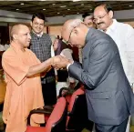  ?? PTI ?? NDA’s presidenti­al nominee Ram Nath Kovind accepts greetings of Uttar Pradesh Chief Minister Yogi Adityanath at an NDA meeting at Parliament in New Delhi on Friday. —