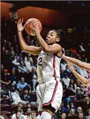  ?? Tyler Sizemore/Hearst Connecticu­t Media ?? UConn’s KK Arnold pulls down a rebound against Marquette on Sunday.