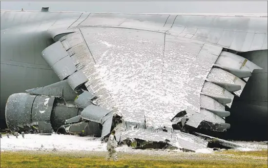  ?? Chris Gardner Associated Press ?? THE PENTAGON ceased training with firefighti­ng foam, but still uses it in aircraft fires. Above, foam on an Air Force C-5 Galaxy that crashed in 2006 in Dover, Del.