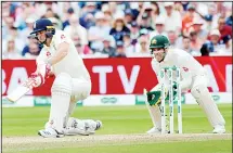  ??  ?? England’s Chris Woakes plays a shot during day three of the first Ashes Test cricket match between England and Australia at Edgbaston in Birmingham, England on Aug 3. (AP)