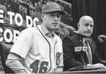  ?? Pablo Martinez Monsivais / Associated Press ?? Patrick Corbin’s introducto­ry news conference Friday with Nationals GM Mike Rizzo was overshadow­ed by Washington owner Mark Lerner’s comments about free agent Bryce Harper.