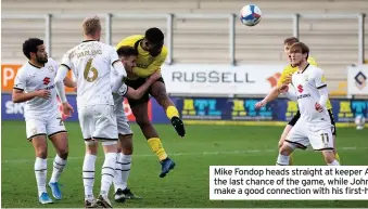  ??  ?? Mike Fondop heads straight at keeper Andrew Fisher with the last chance of the game, while John Brayford cannot make a good connection with his first-half chance.