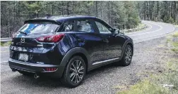  ??  ?? The CX-3’s interior has an upscale feel to it. On the road, the cute-ute is right at home navigating the open twisties.