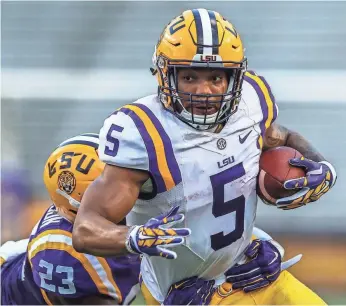  ?? STEPHEN LEW, USA TODAY SPORTS ?? Running back Derrius Guice averaged 7.58 per carry racking up 1,387 yards last year for LSU.