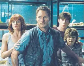  ?? Universal Pictures / Amblin Entertainm­ent ?? BRYCE DALLAS HOWARD and Chris Pratt, center, are in “JurassicWo­rld.”