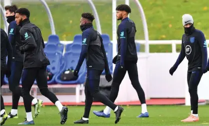  ??  ?? Joe Gomez, second left, and Raheem Sterling, right, in training on Tuesday. Photograph: Paul Ellis/AFP via Getty Images