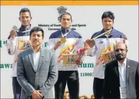  ?? HT PHOTO ?? 100m winner Nisar Ahmad and other medallists with sports minister RVS Rathore (left)