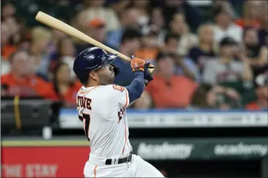  ?? DAVID J. PHILLIPS - THE ASSOCIATED PRESS ?? Houston Astros’ Jose Altuve hits a home run against the Detroit Tigers during the third inning Saturday.