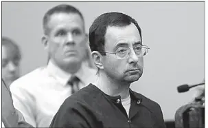  ?? AP/CARLOS OSORIO ?? Larry Nassar sits Wednesday at his sentencing hearing in Lansing, Mich., for the sexual abuse of dozens of women and girls.