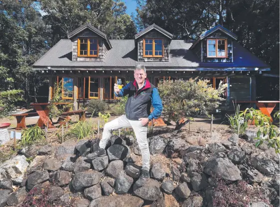  ?? Picture: GLENN HAMPSON ?? Binna Burra Lodge reopens on Tuesday, and Lodge CEO Jonathan Fisher celebrates with a cool beverage at the Grooms Cottage.