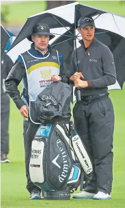  ?? Picture: Getty. ?? Thomas Detry, right, and caddy Ryan.