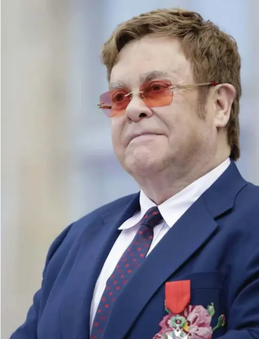  ?? File/associated Press Agence France-presse ?? Elton John poses at a ceremony honouring him with the Legion of Honour in Paris.