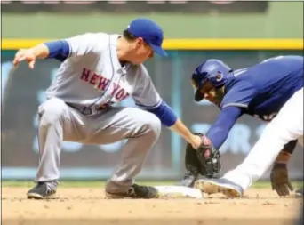  ?? DARREN HAUCK — THE ASSOCIATED PRESS ?? The Brewers’ Jonathan Villar, right, steals second base against Mets second baseman Kelly Johnson, left, during the fifth inning Sunday in Milwaukee.